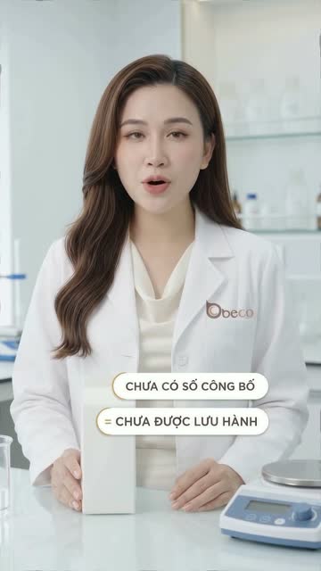 Chuyên viên BECO mặc áo blouse trắng đứng bên bàn lab, cạnh hộp sản phẩm trắng và cân điện tử, trên hình có dòng chữ "Chưa có số công bố = Chưa được lưu hành"